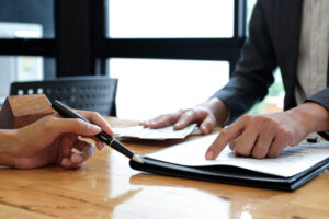 two people reviewing a contract