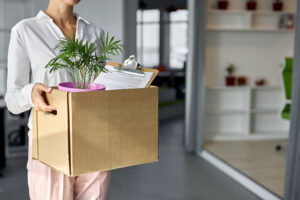 laid off worker leaving with box of belongings