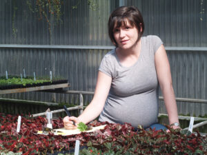pregnant worker at plant nursery